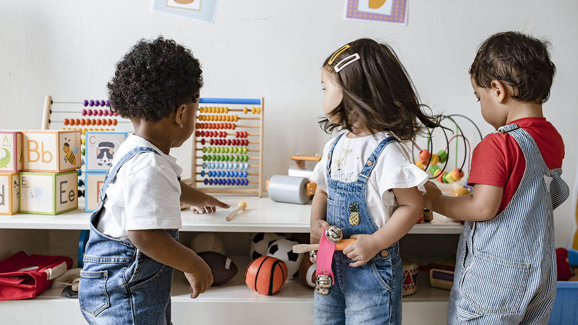 Children play with backs to camera