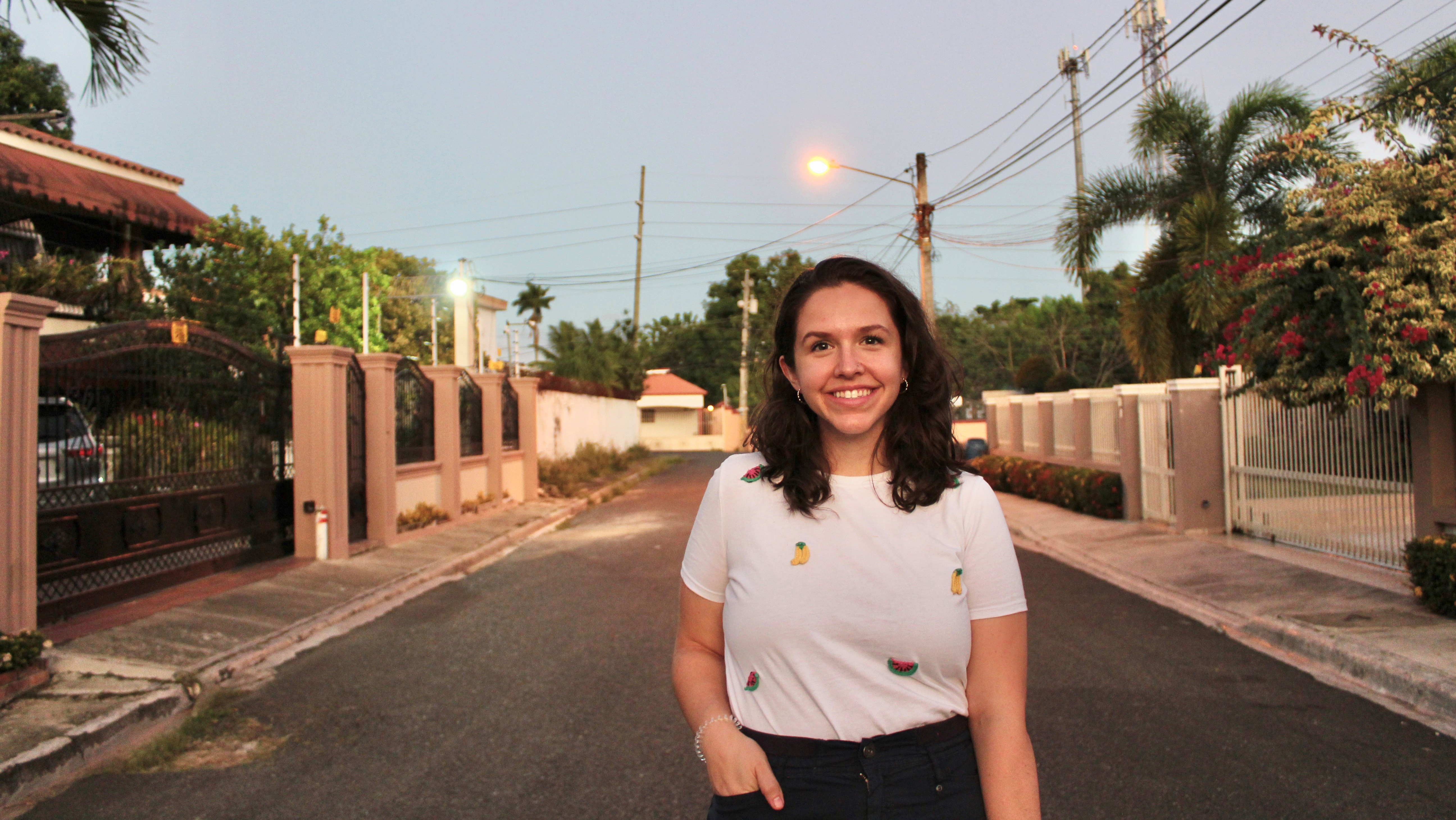news_katie-macdonald_1160x653_2022-12-05.jpg Katie MacDonald, wearing a white T-shirt, stands on a street in the Dominican Republic