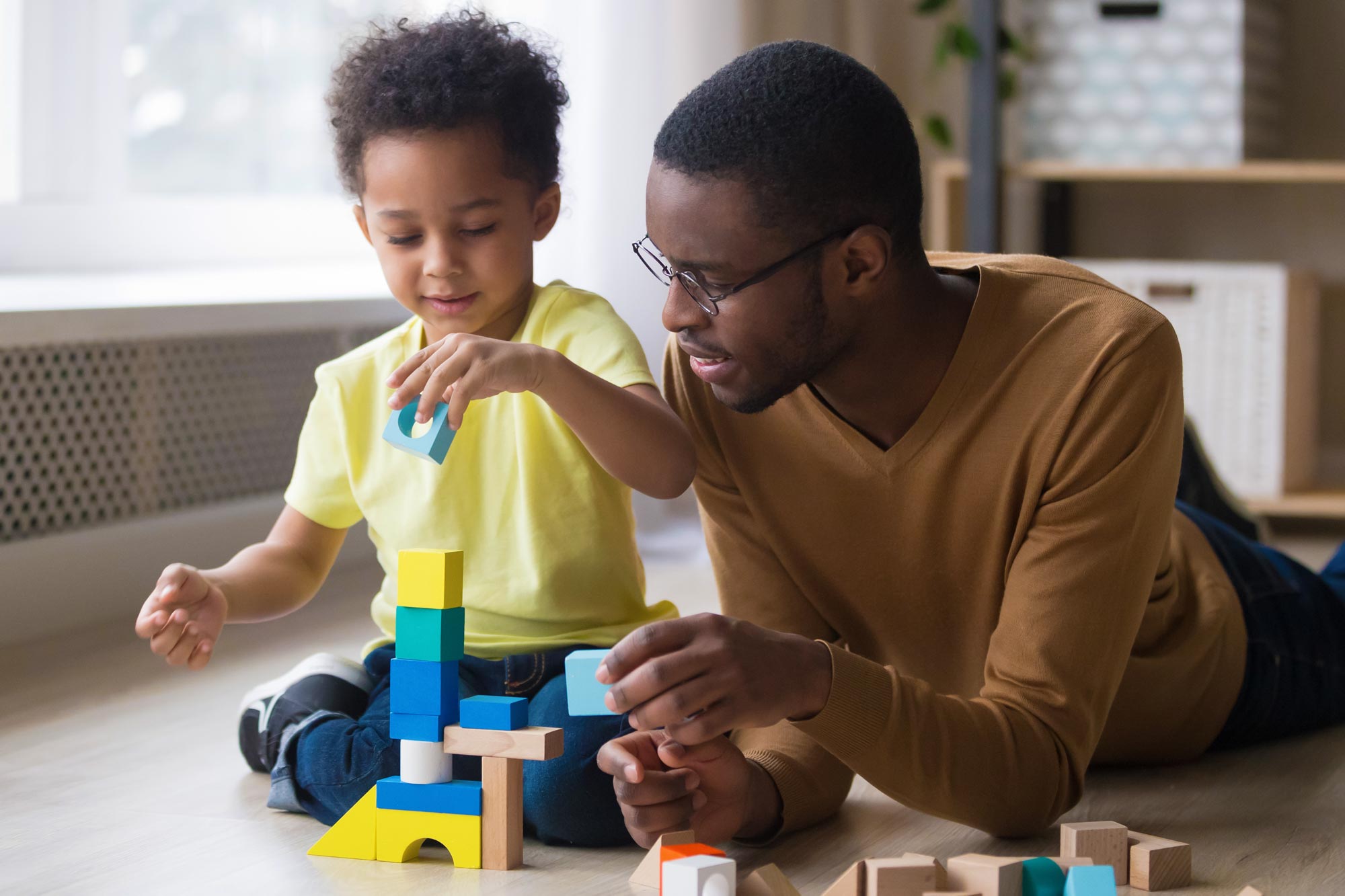 Adult playing with child