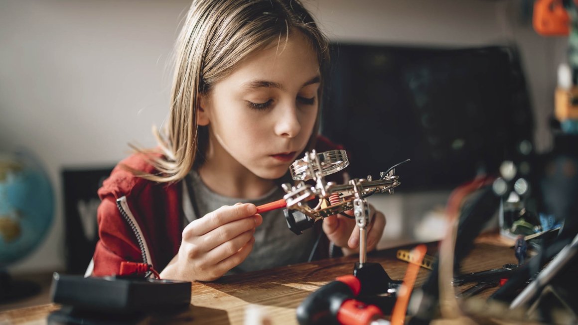 Headshot of teen with science equipment