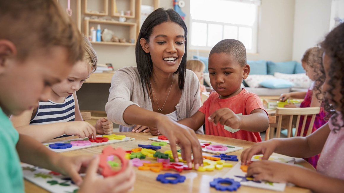 Adult playing with children