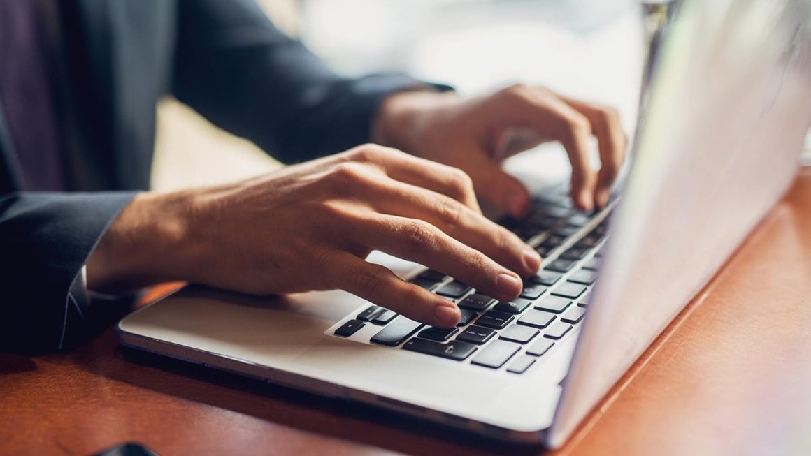 Person typing on a laptop