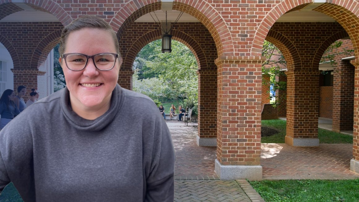 Katie Leigh smiling with a photo background of the Breneman Courtyard.