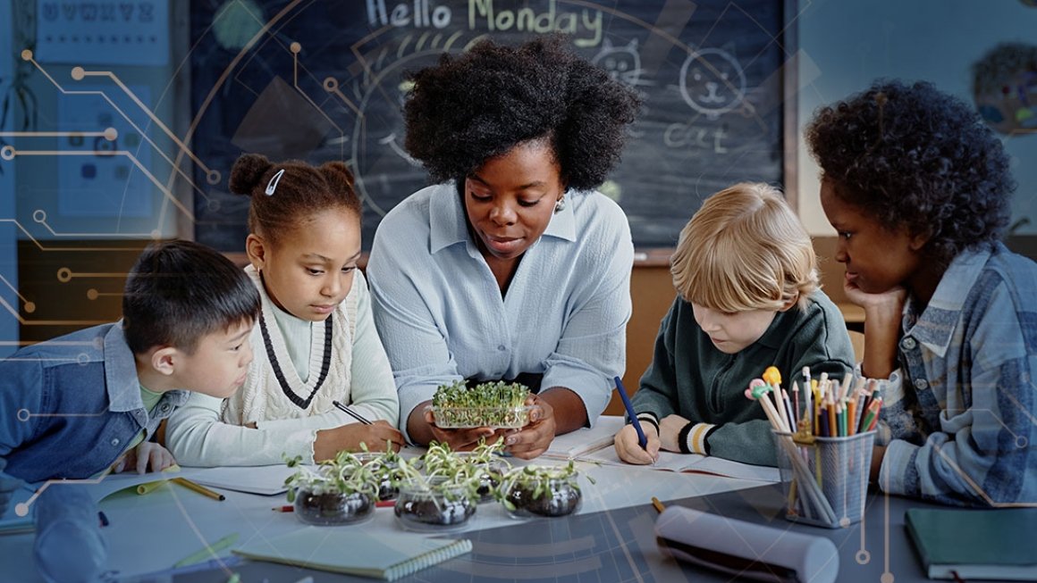 Teacher and four students sit at table looking at plants.
