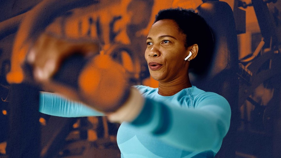 Woman uses a weight training machine