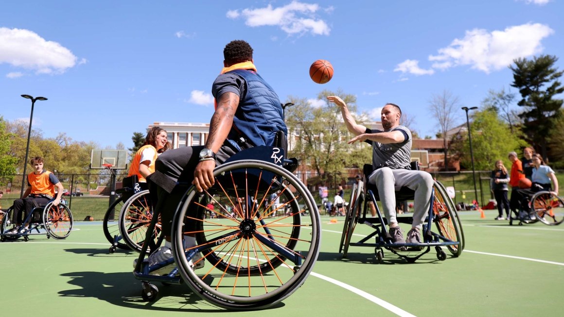 People playing a game of wheelchair basketball
