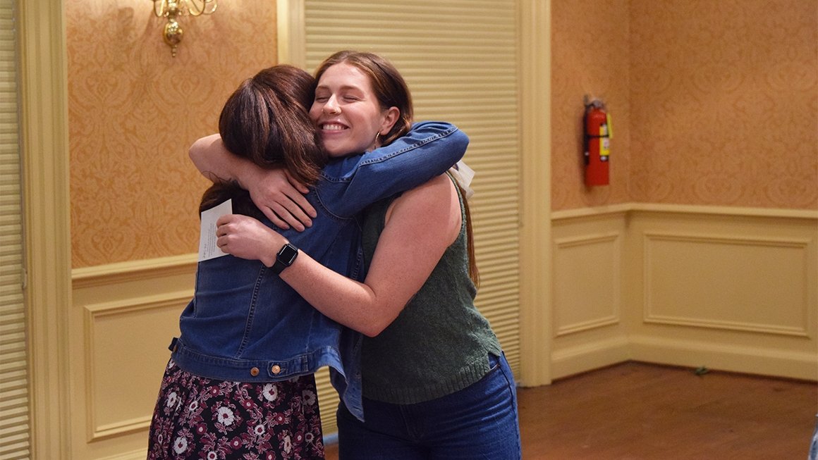 Two people hugging