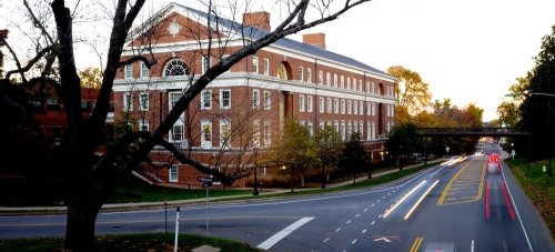 Bavaro Hall at dusk with dark tree branches in the foreground