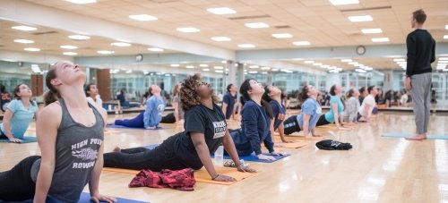 College-age students in a yoga class