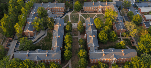 An aerial view of UVA McCormick dormitories surrounded by green foliage