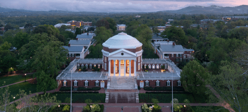 An aerial view of the UVA Rotunda and the Lawn at dusk