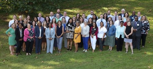 The SCOPE class of 18 stands together outside