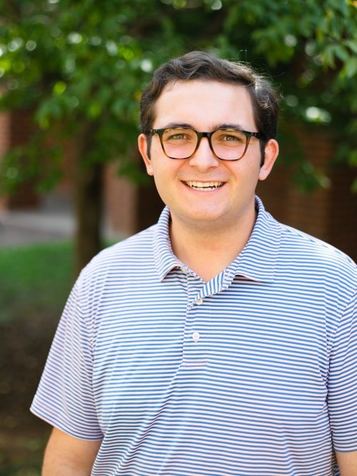 Andy Harris wearing a blue striped shirt