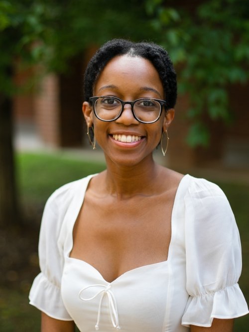 Zahra Edwards wearing a white top photographed outside