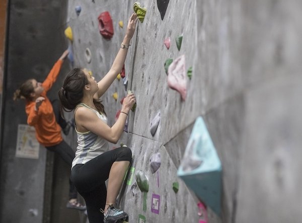 Checkboard_Kinesiology-LPA_600x444_2020-07-14.jpg Two students climbing an indoor rock wall