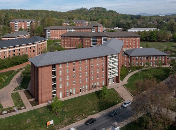 Aerial view of dorm buildings at UVA on Alderman Road. Dorms are several stories high and brick.