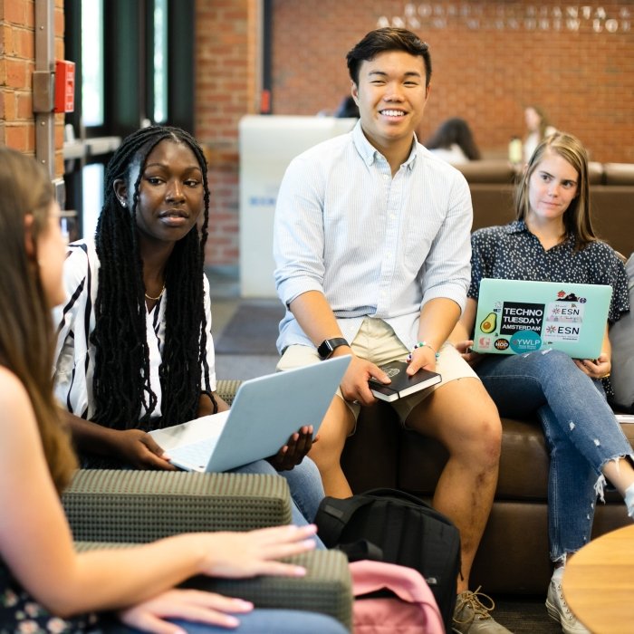College students talk and relax in a student lounge