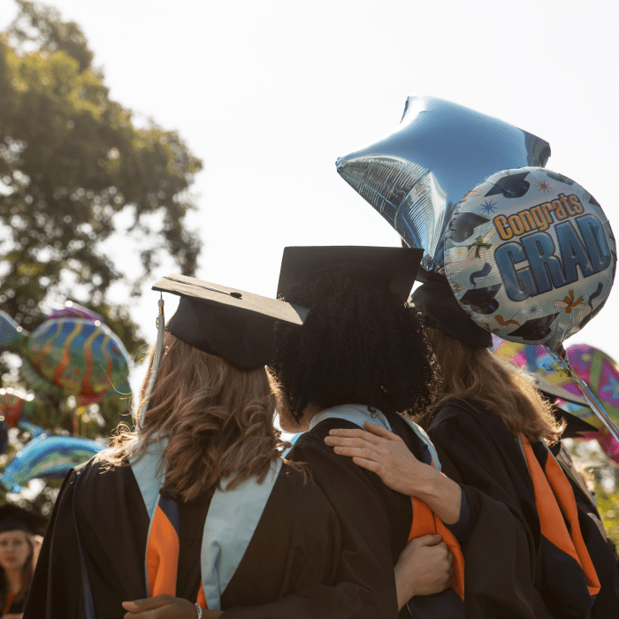 Graduates pose for a picture