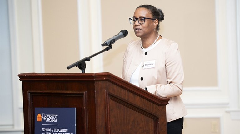 Dean Stephanie Rowley speaking at a podium.