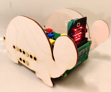 Small robot with wooden pieces the shape of a turtle on each side
